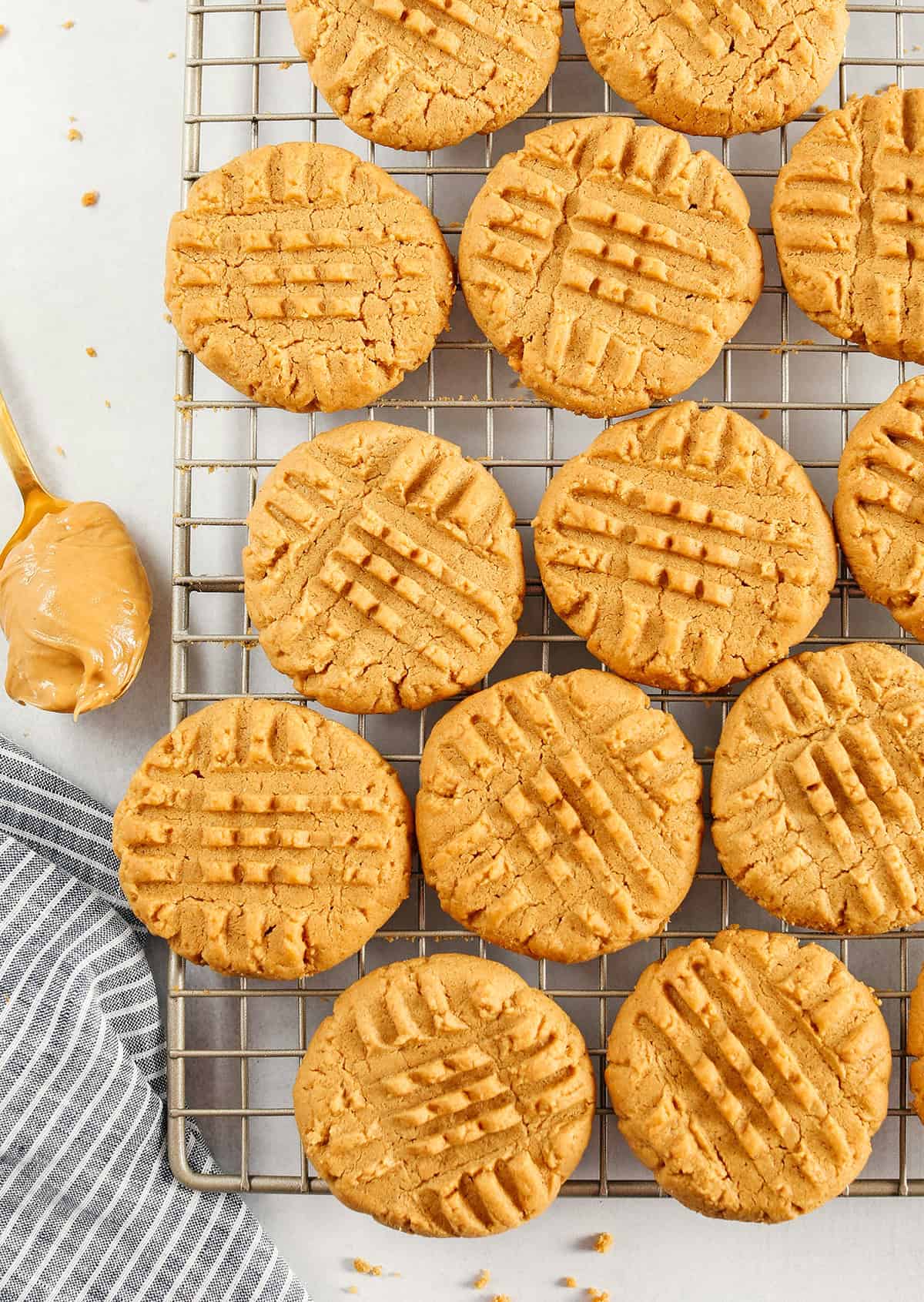 The BEST 5-Ingredient Peanut Butter Cookies recipe made with simple pantry ingredients and zero flour, butter or oil!  Soft, chewy cookies with rich peanut butter flavor are the perfect gluten-free sweet treat.