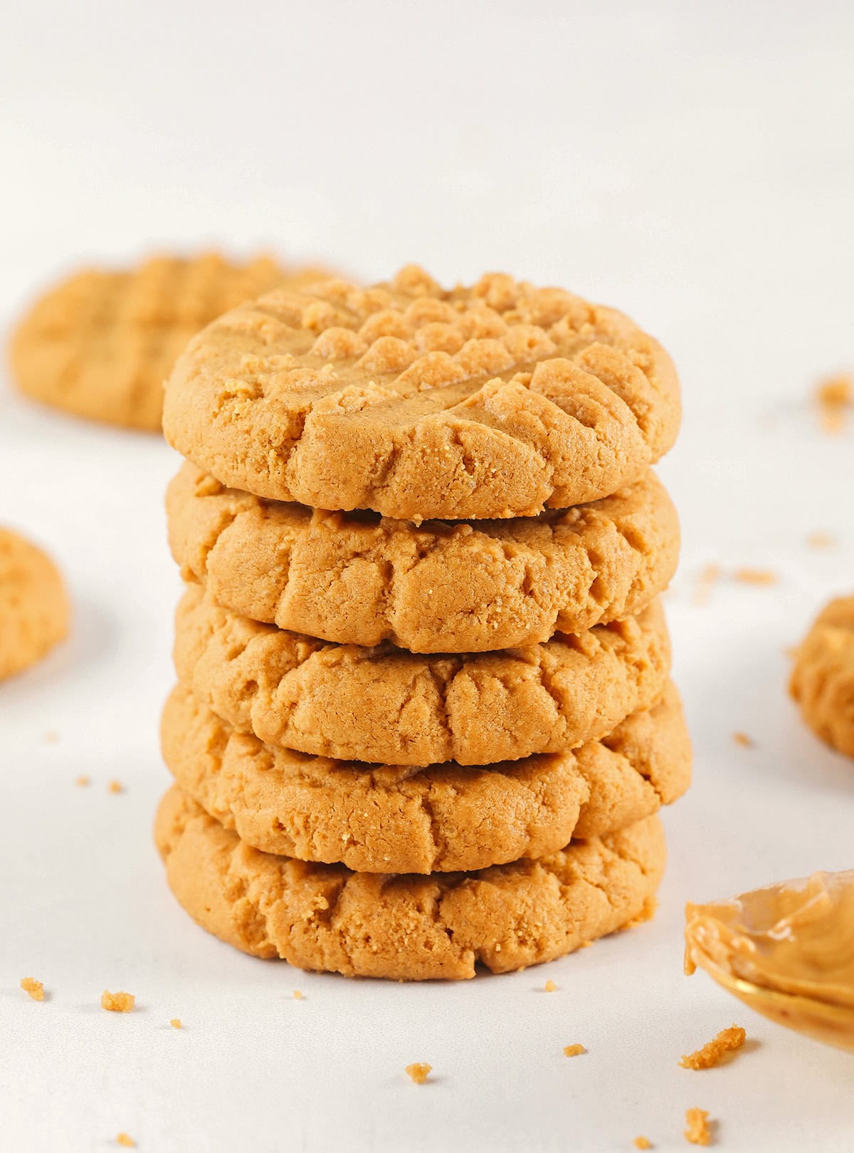 The BEST 5-Ingredient Peanut Butter Cookies recipe made with simple pantry ingredients and zero flour, butter or oil!  Soft, chewy cookies with rich peanut butter flavor are the perfect gluten-free sweet treat.