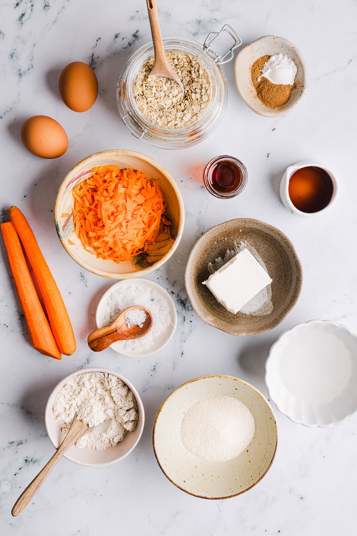 These EASY Healthy Carrot Cake Oatmeal Breakfast Bars make a quick on-the-go breakfast, snack or wholesome dessert! Made with zero refined sugar and drizzled with a delicious maple cream cheese frosting.