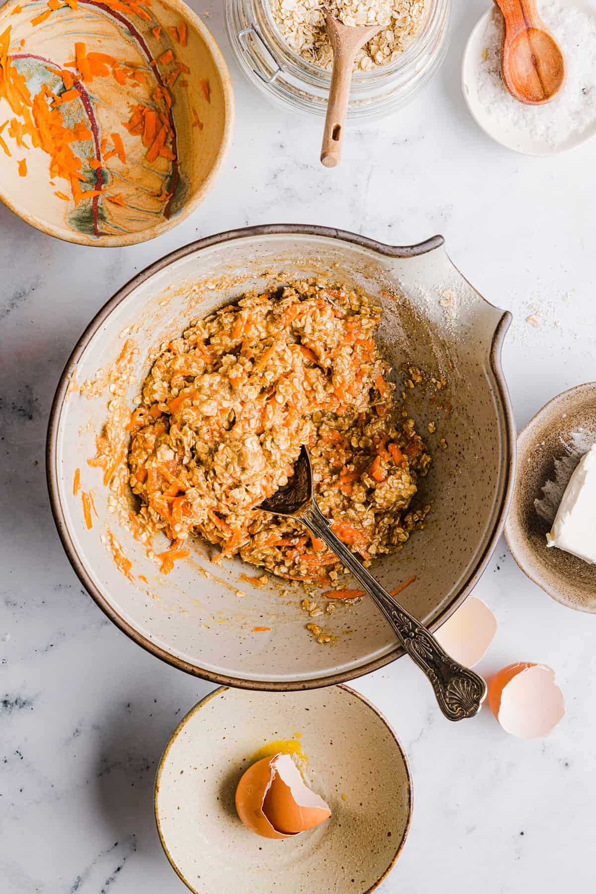 These EASY Healthy Carrot Cake Oatmeal Breakfast Bars make a quick on-the-go breakfast, snack or wholesome dessert! Made with zero refined sugar and drizzled with a delicious maple cream cheese frosting.