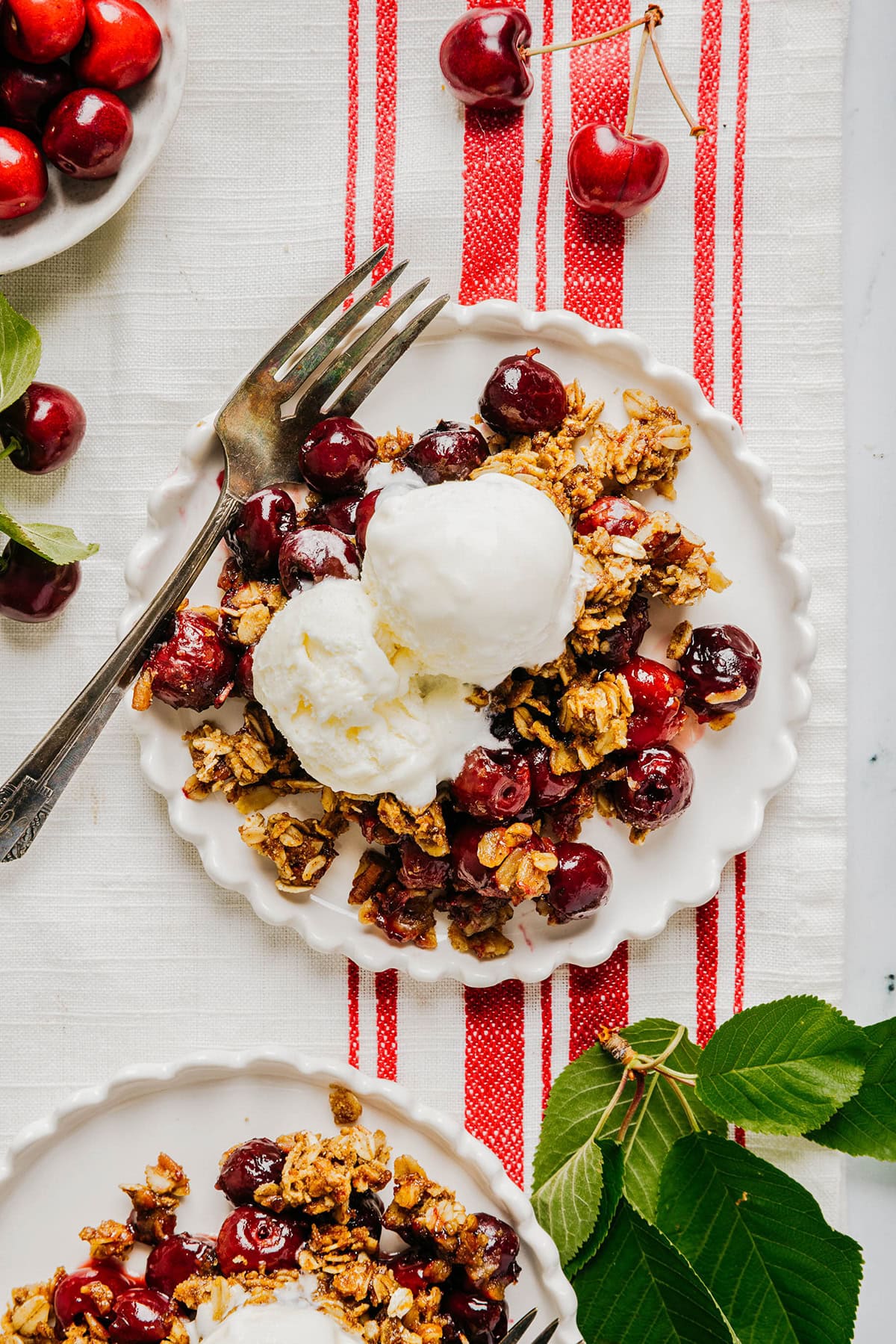 This Healthy Cherry Crisp is the ultimate summer dessert! Bursting with sweet cherries and a wholesome oat topping, this warm cherry crisp easily comes together with just a few simple ingredients!