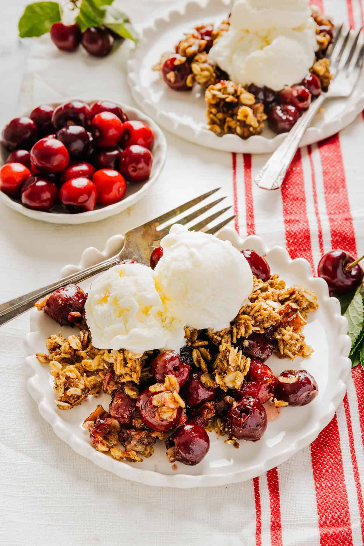 This Healthy Cherry Crisp is the ultimate summer dessert! Bursting with sweet cherries and a wholesome oat topping, this warm cherry crisp easily comes together with just a few simple ingredients!