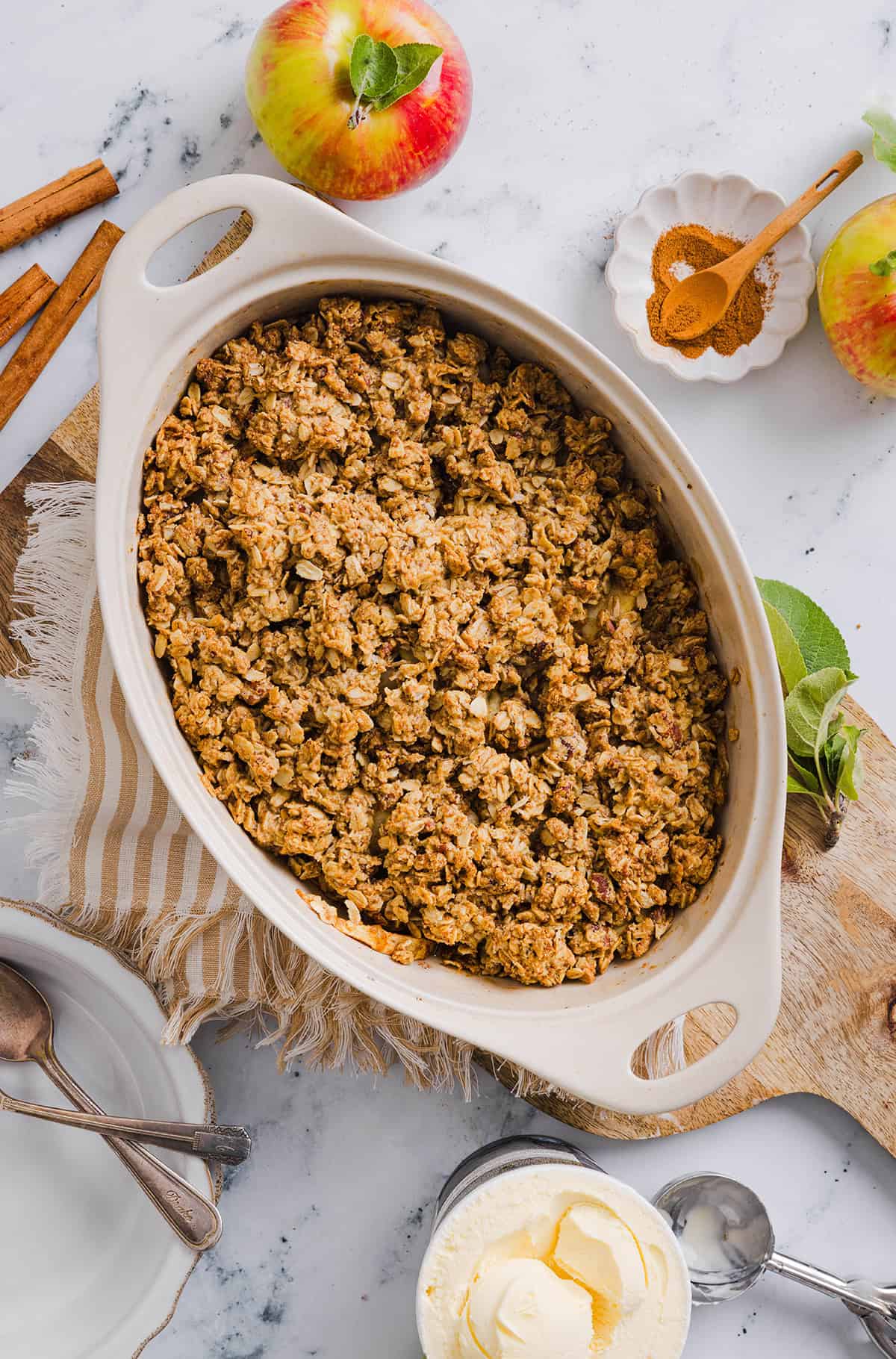 This Healthy Apple Crisp is loaded with tender apples and warm spices, naturally sweetened with maple syrup, all topped with a crunchy oatmeal pecan topping for the perfect fall dessert!