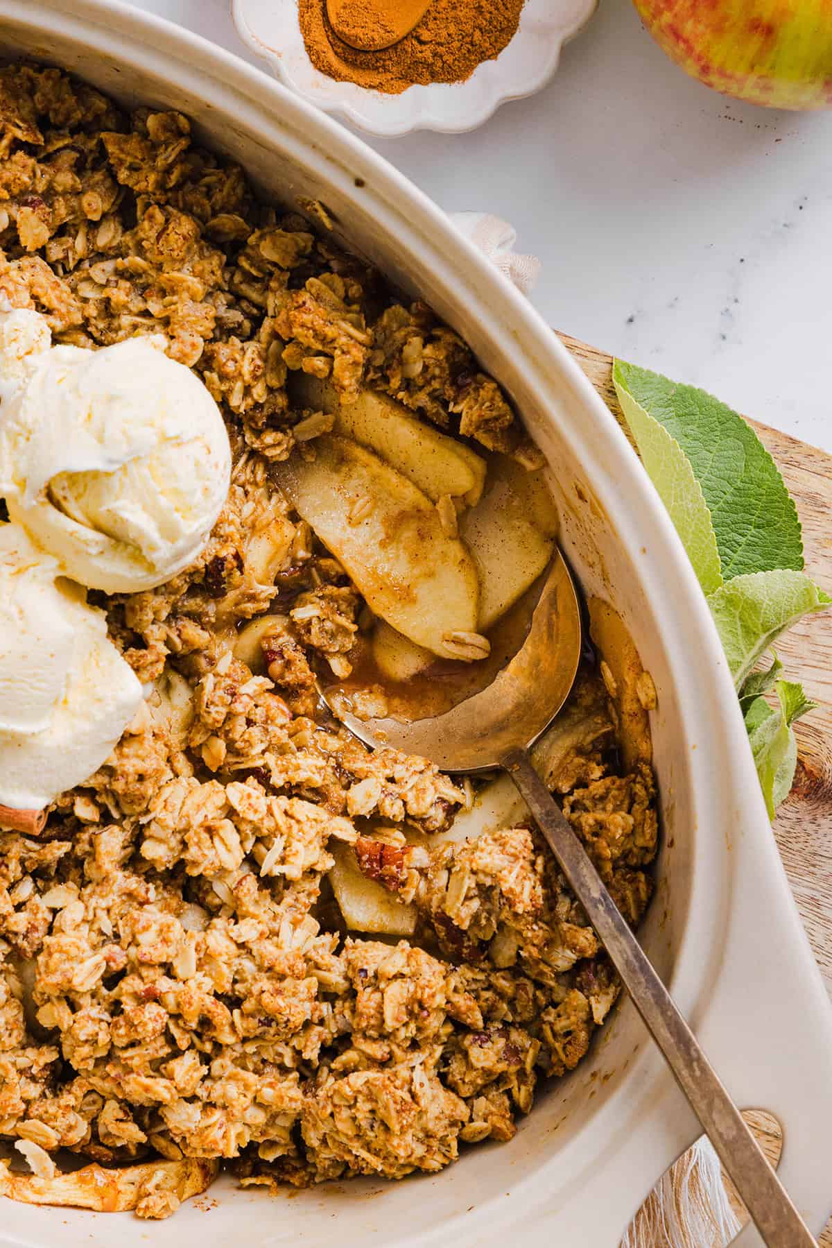 This Healthy Apple Crisp is loaded with tender apples and warm spices, naturally sweetened with maple syrup, all topped with a crunchy oatmeal pecan topping for the perfect fall dessert!