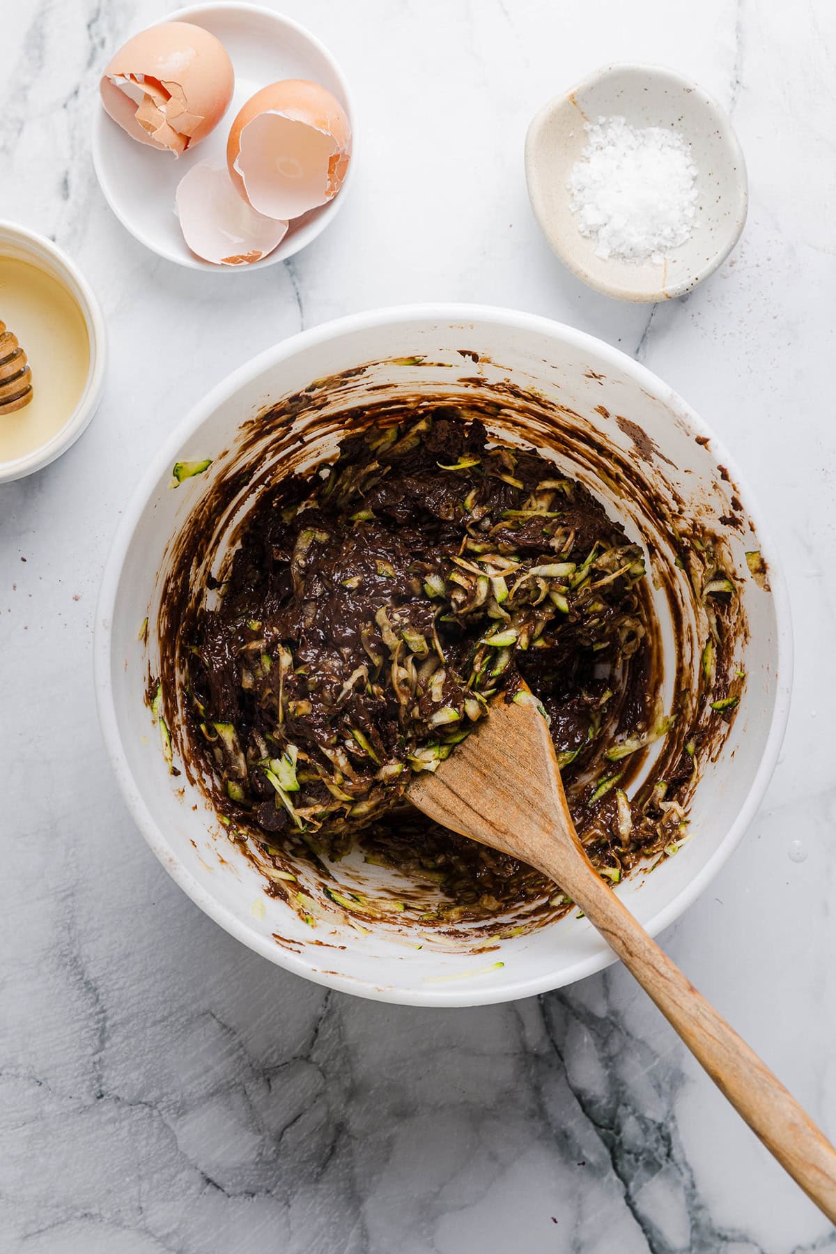 These Fudgy Zucchini Brownies are deliciously moist with a rich chocolate taste loaded with shredded zucchini and made healthier with zero butter or refined sugar! One of our family's favorite summer desserts!