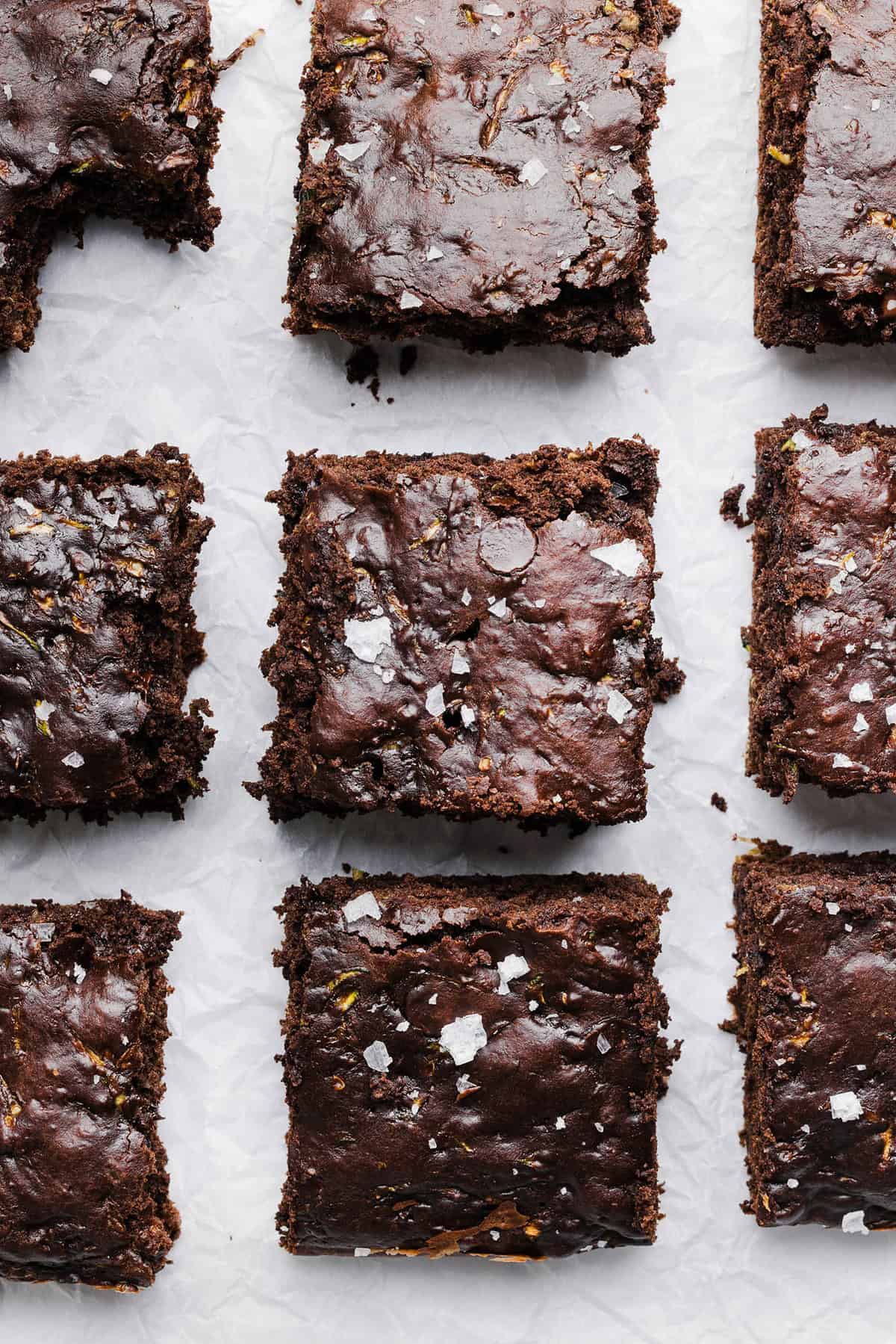 These Fudgy Zucchini Brownies are deliciously moist with a rich chocolate taste loaded with shredded zucchini and made healthier with zero butter or refined sugar! One of our family's favorite summer desserts!