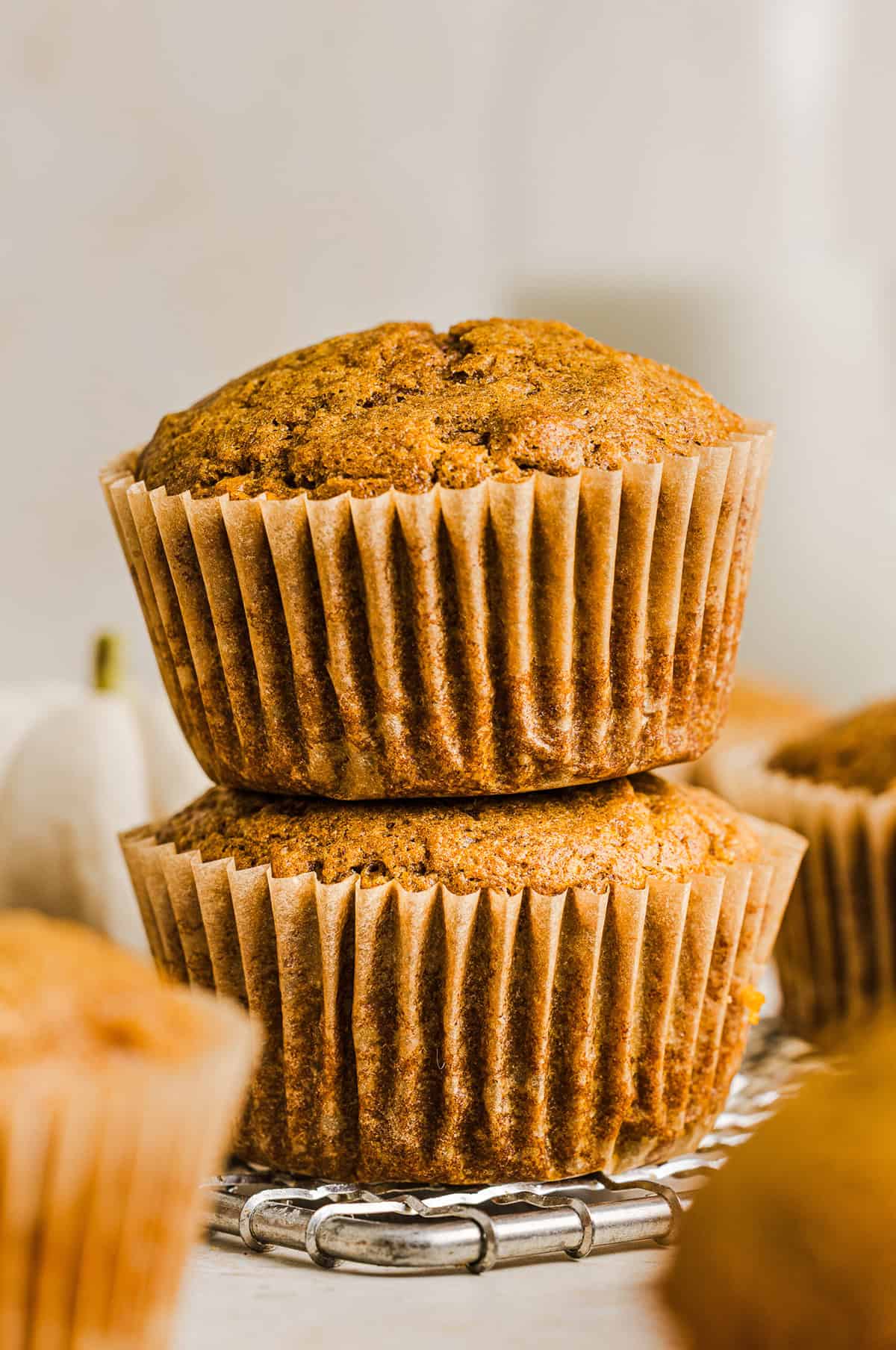 These Whole Wheat Pumpkin Muffins are moist, fluffy, and made healthier with whole wheat flour, applesauce, and zero butter or refined sugar. Loaded with delicious pumpkin flavor and warm spices for the perfect fall muffin!