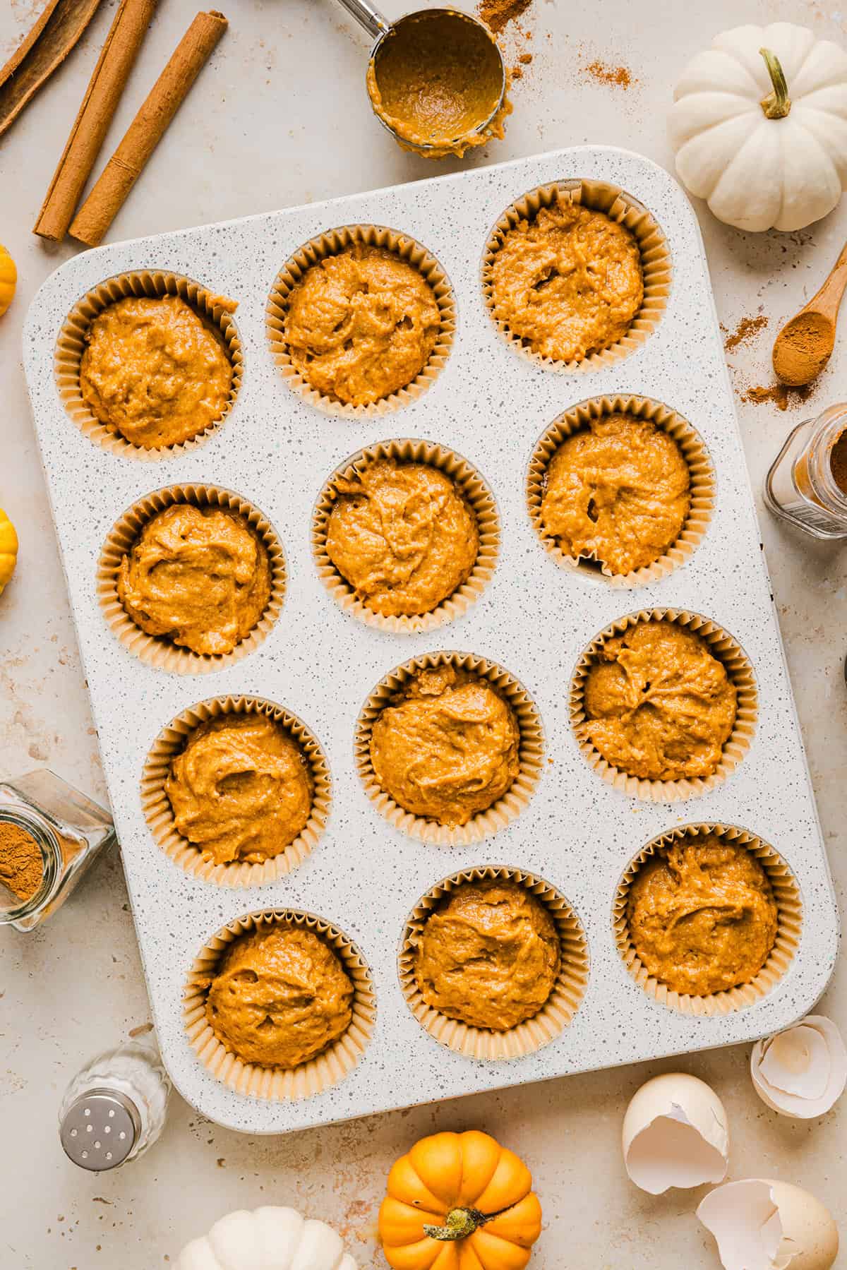 These Whole Wheat Pumpkin Muffins are moist, fluffy, and made healthier with whole wheat flour, applesauce, and zero butter or refined sugar. Loaded with delicious pumpkin flavor and warm spices for the perfect fall muffin!