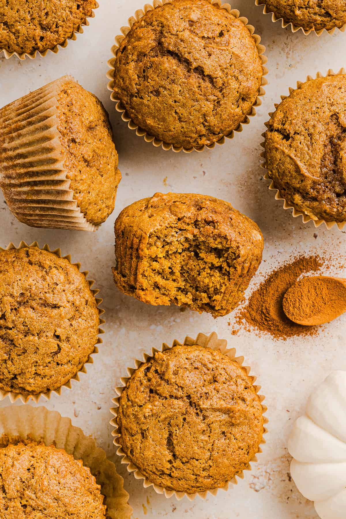 These Whole Wheat Pumpkin Muffins are moist, fluffy, and made healthier with whole wheat flour, applesauce, and zero butter or refined sugar. Loaded with delicious pumpkin flavor and warm spices for the perfect fall muffin!